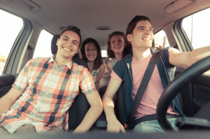 Four Friends in a Car Leaving For Vacation