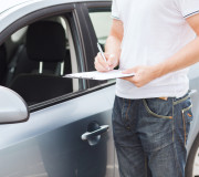 man with car documents